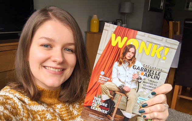 Photo of Hannah Needham, editor of Wonk! magazine, holding up a copy of the magazine